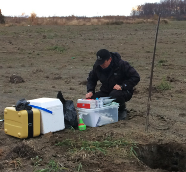 Man outside doing field research